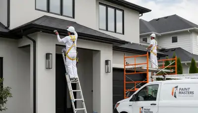 Professional gutter painting on Andover, MA home exterior by expert house painters